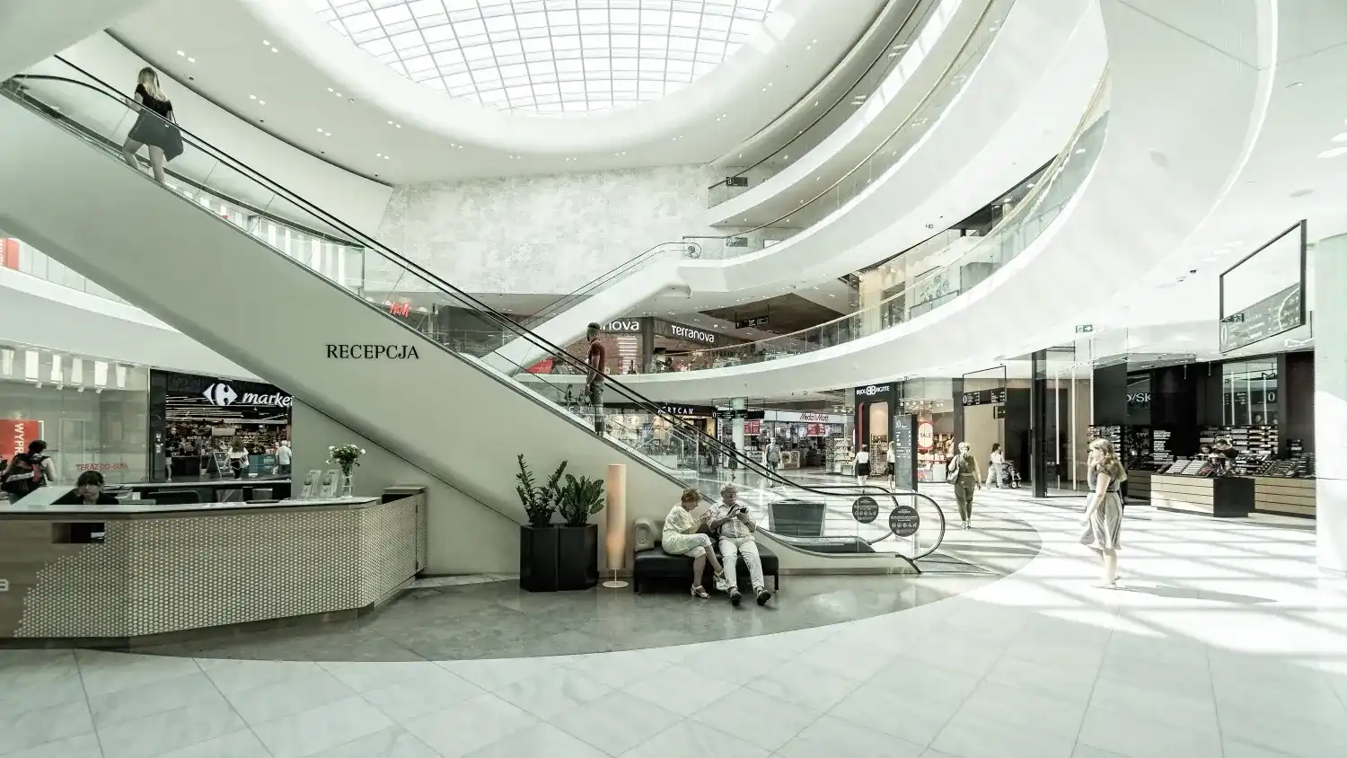 mall with white escalator in white